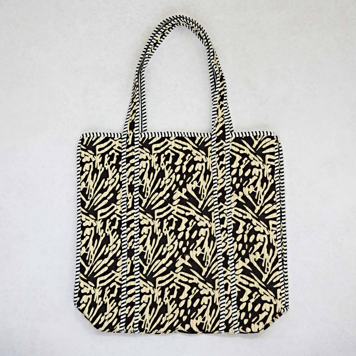 Tote bag with black and white pattern on a light gray background