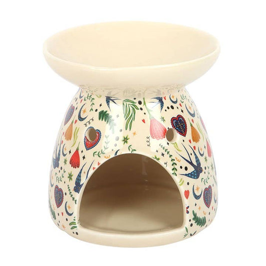 Decorative ceramic oil burner with colorful patterns on a white background