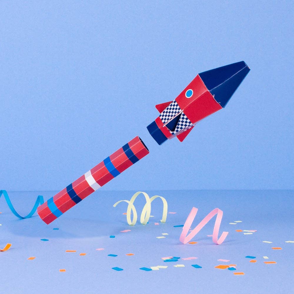 Colorful toy rocket with checkered pattern on a blue background