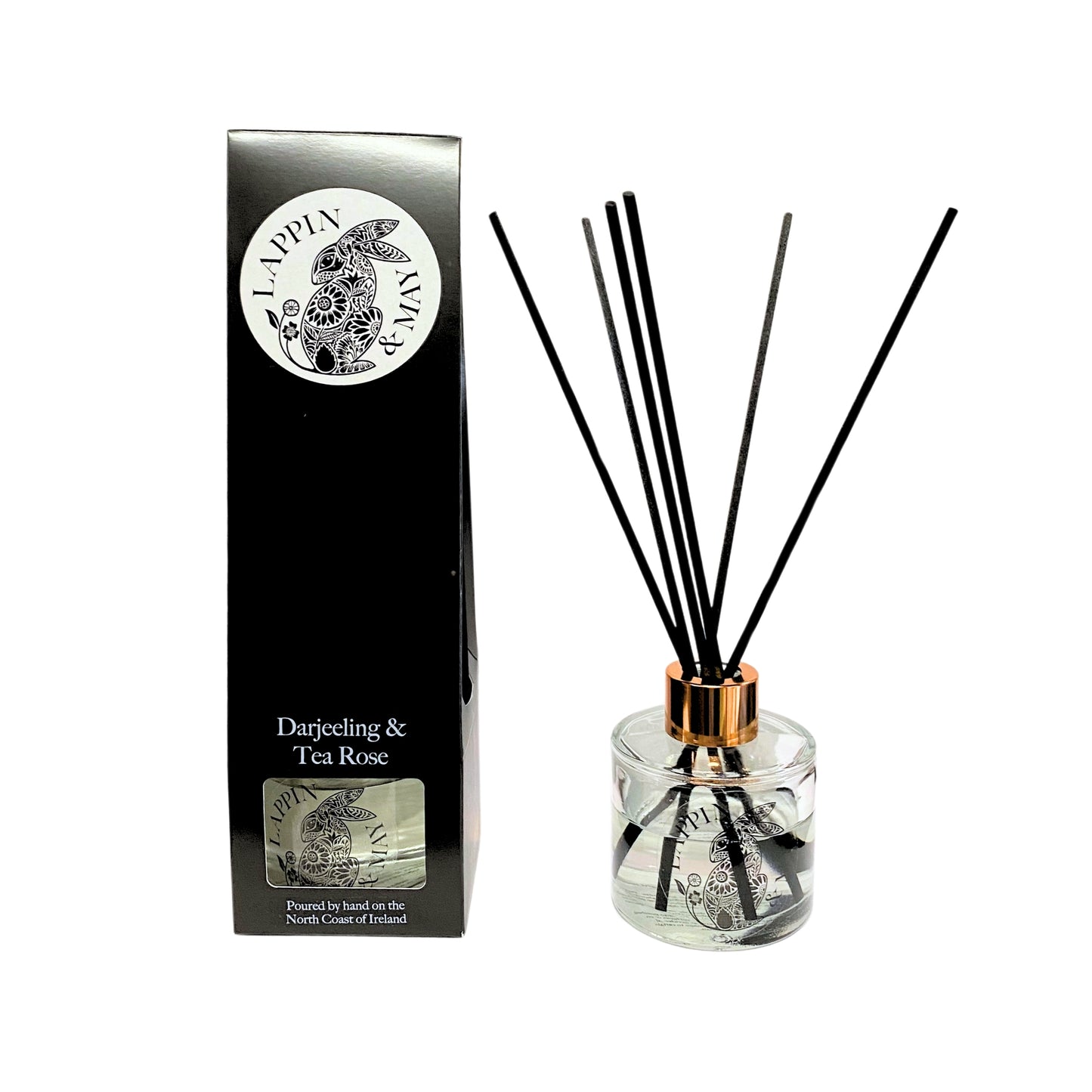 Reed diffuser set with packaging featuring a brand logo on a white background