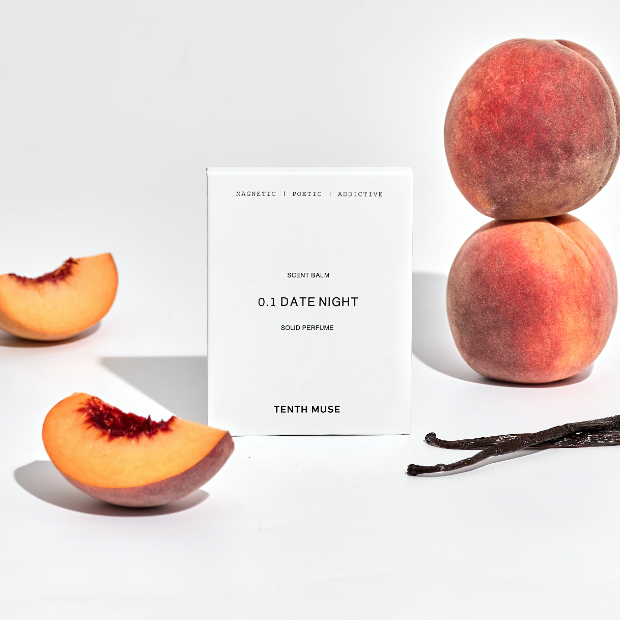 Peaches and a vanilla bean with a product label on a white background