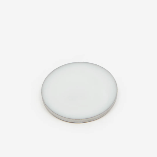 Date Night solid perfume balm disc on white background