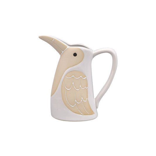 Ceramic pitcher shaped like a pelican on a white background