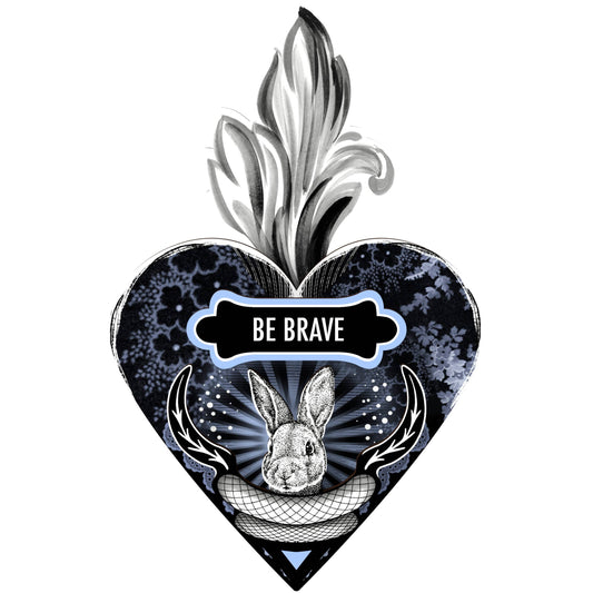 A decorative heart-shaped wall art with a 'Be Brave' motivational quote, a hare motif, and leaf details, predominantly in black, blue, and white colors.