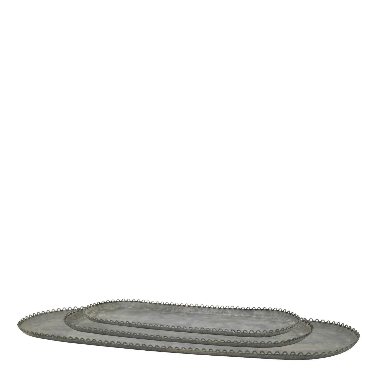 Set of oval metal trays with decorative edges on a white background
