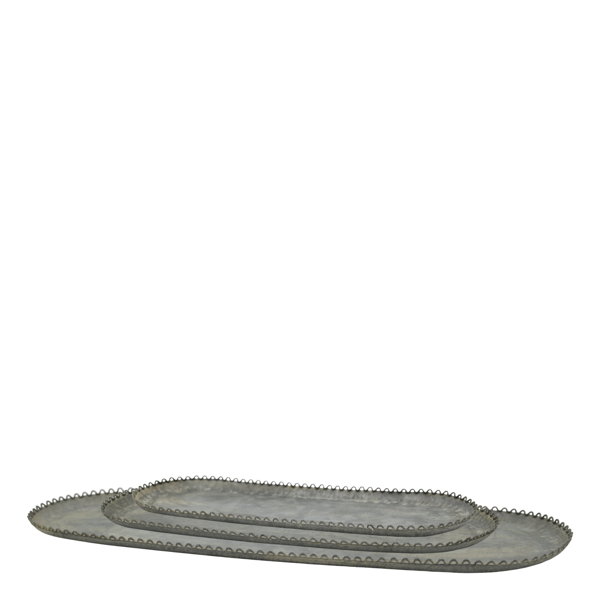 Set of oval metal trays with decorative edges on a white background
