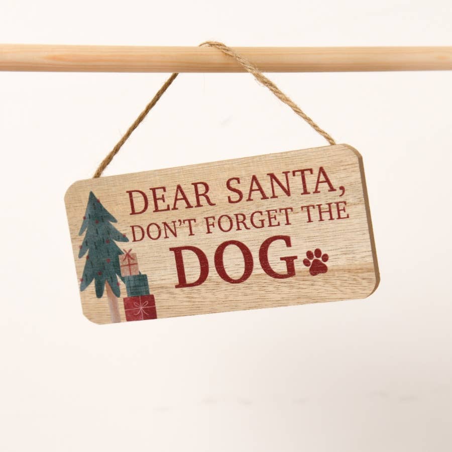 Wooden sign with 'Dear Santa, Don't Forget The Dog' text on a white background