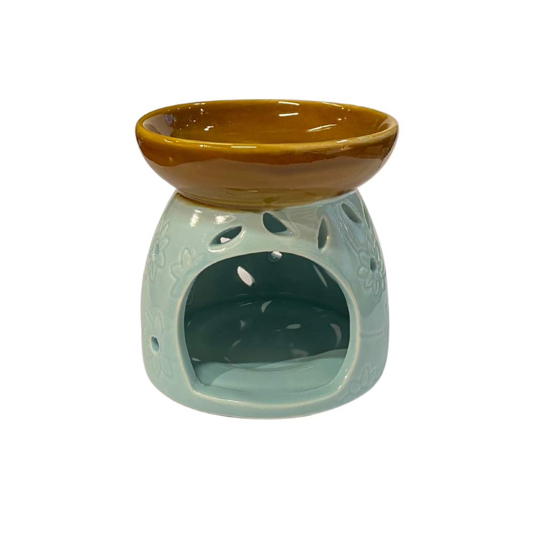 Ceramic oil burner with brown top and light blue base on a white background