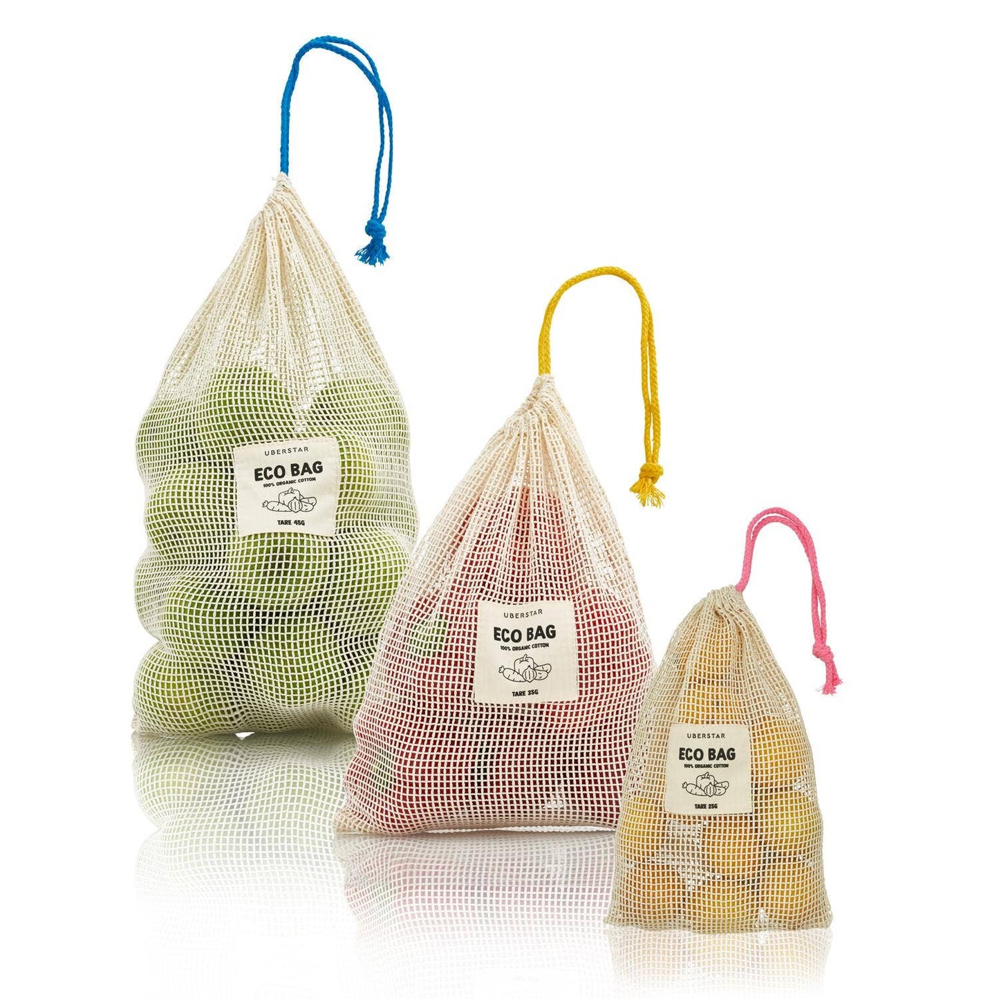 Three mesh eco bags with colorful drawstrings containing fruits on a white background.