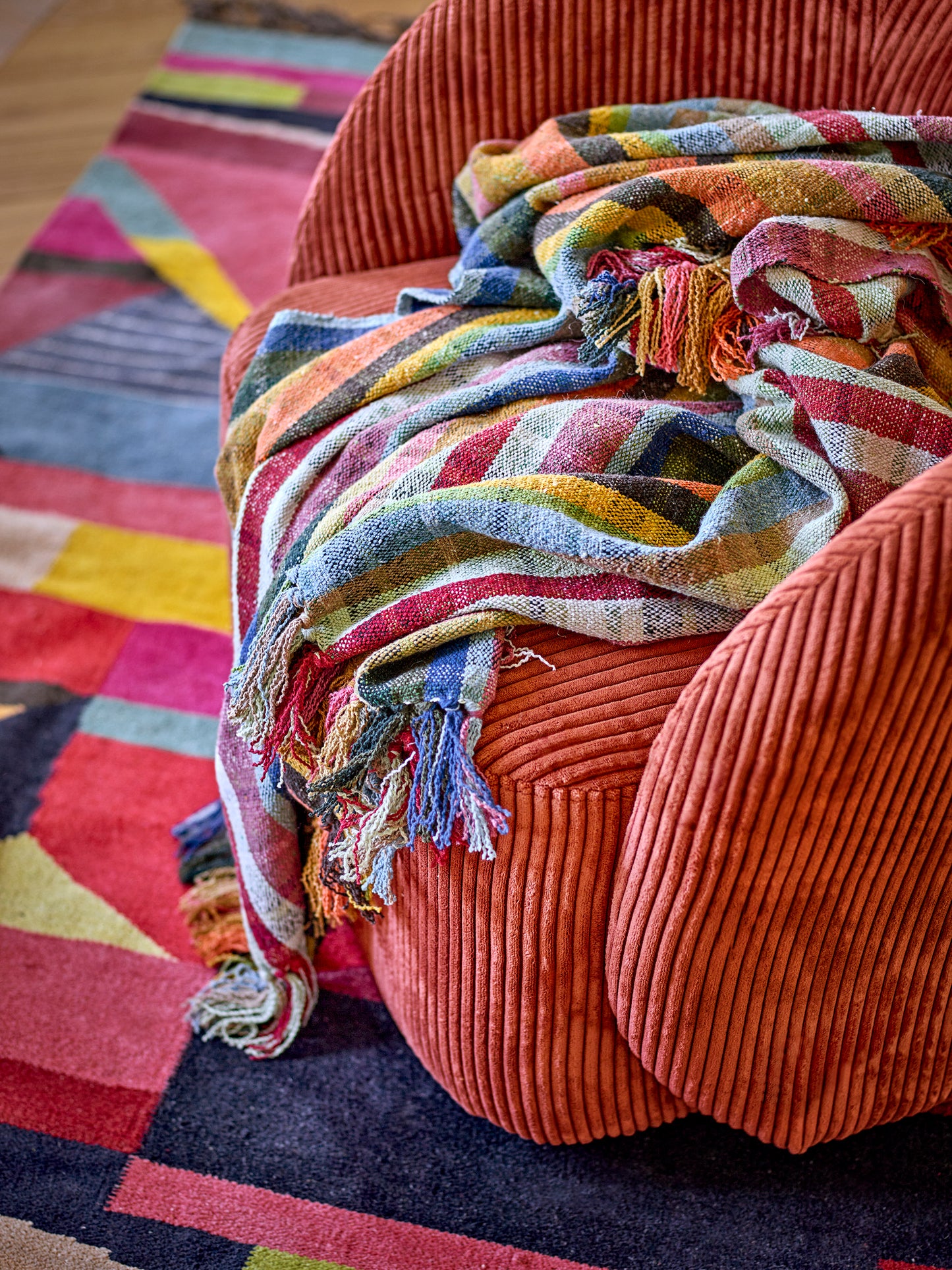 Bloomingville Elmy Recycled Cotton Throw. Colourful Checkered Blanket draped over a chair