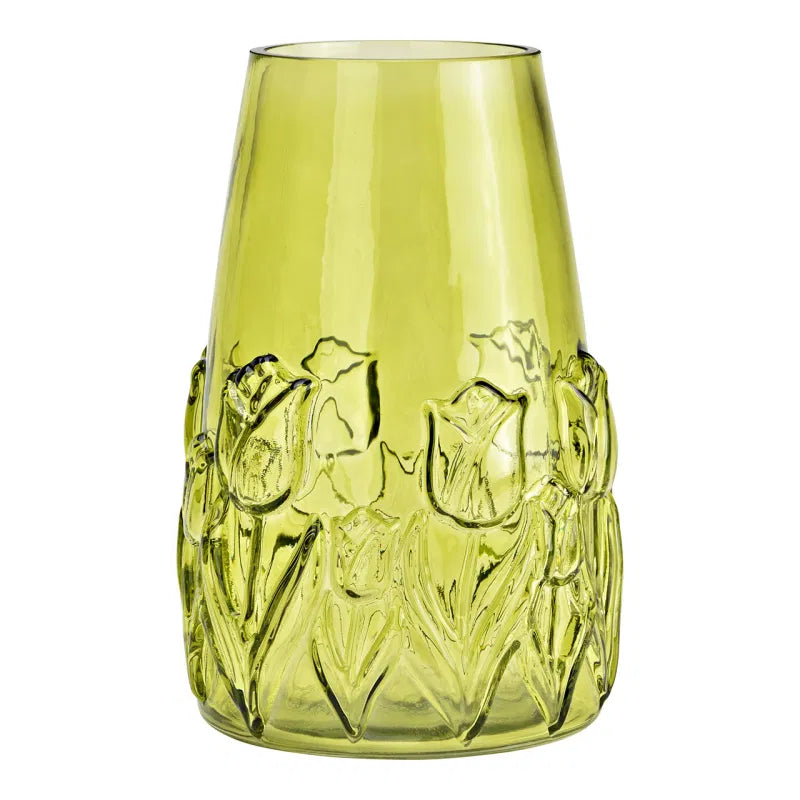 Green glass vase with floral design on a white background