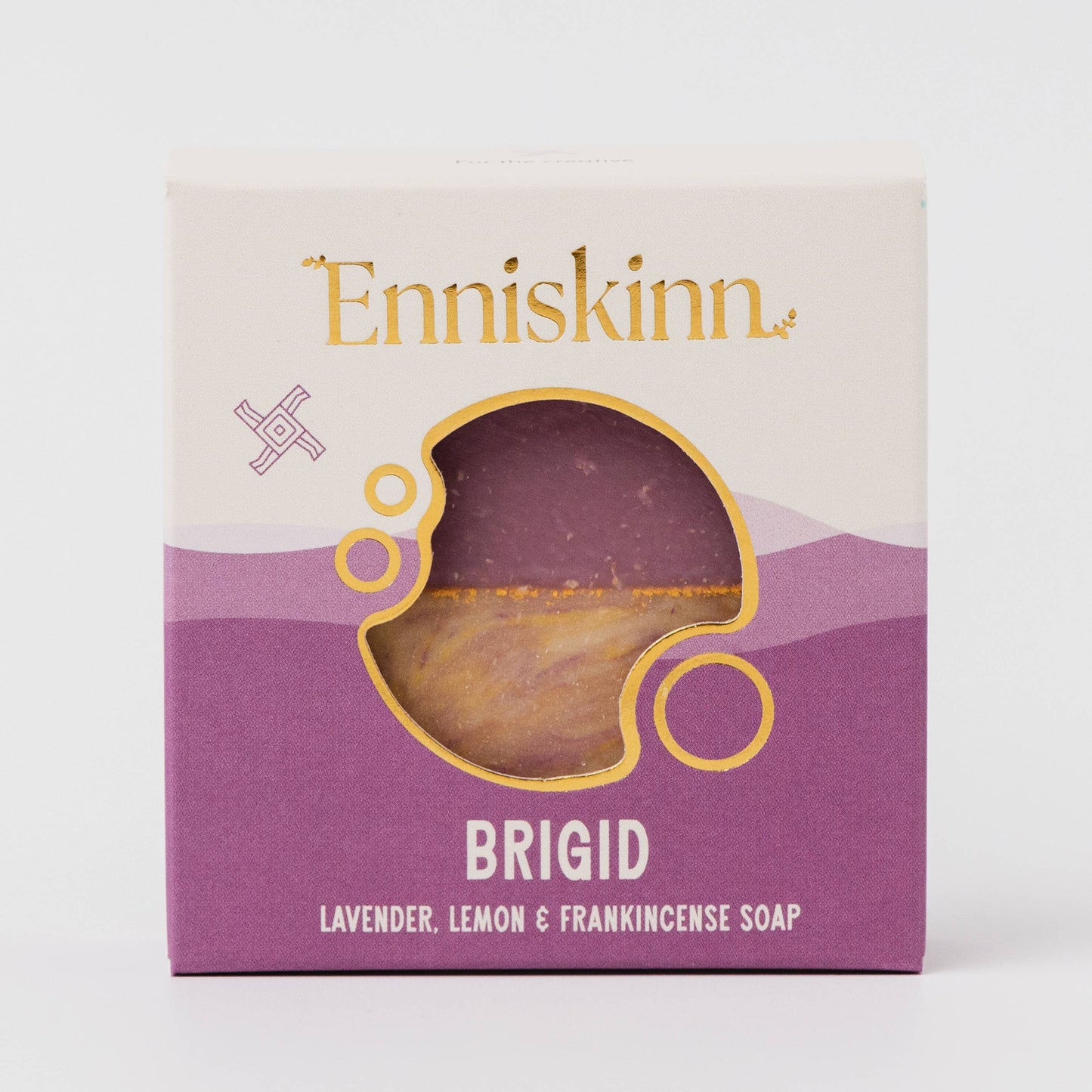 Enniskinn soap packaging with a purple soap visible through a window