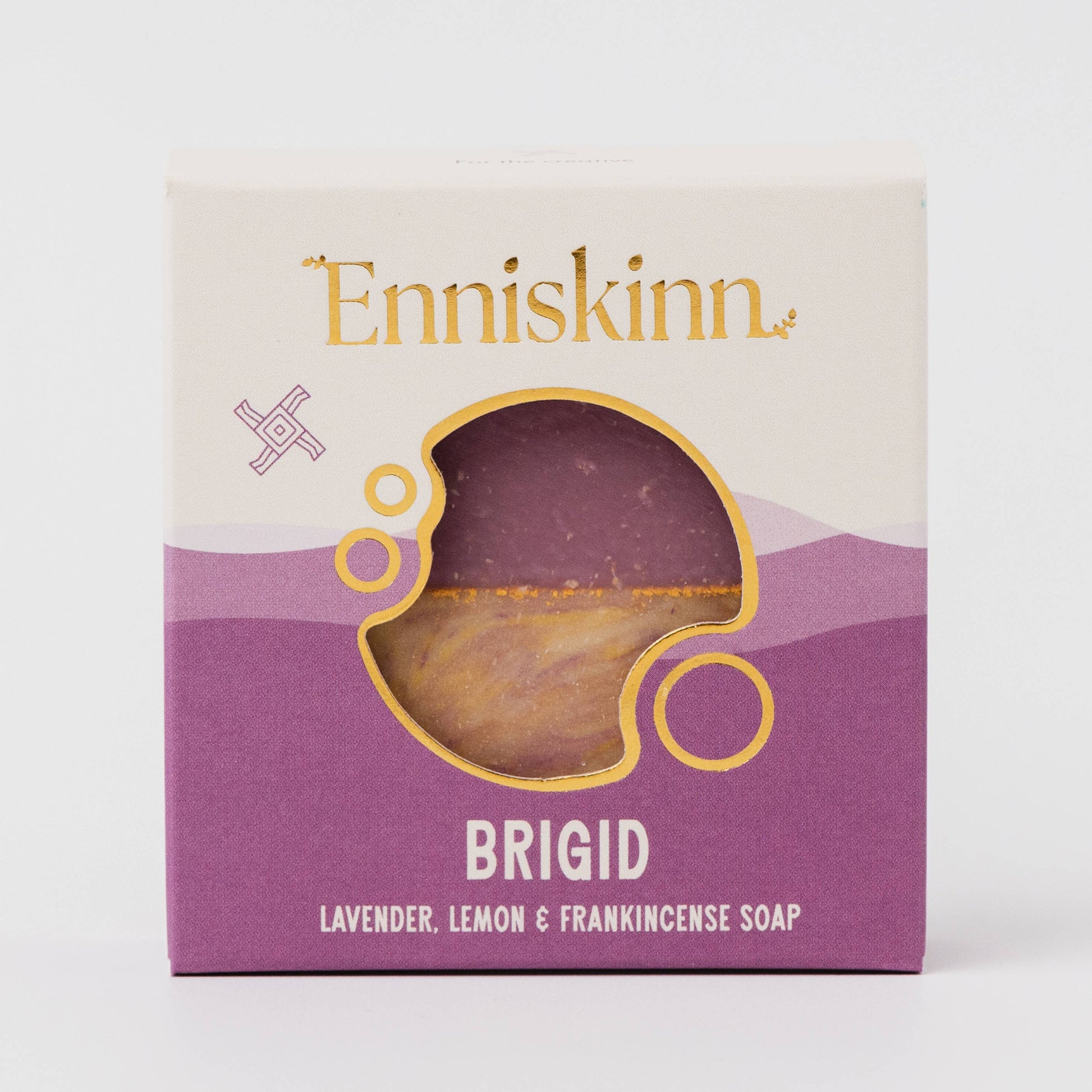 Enniskinn soap packaging with a purple soap visible through a window