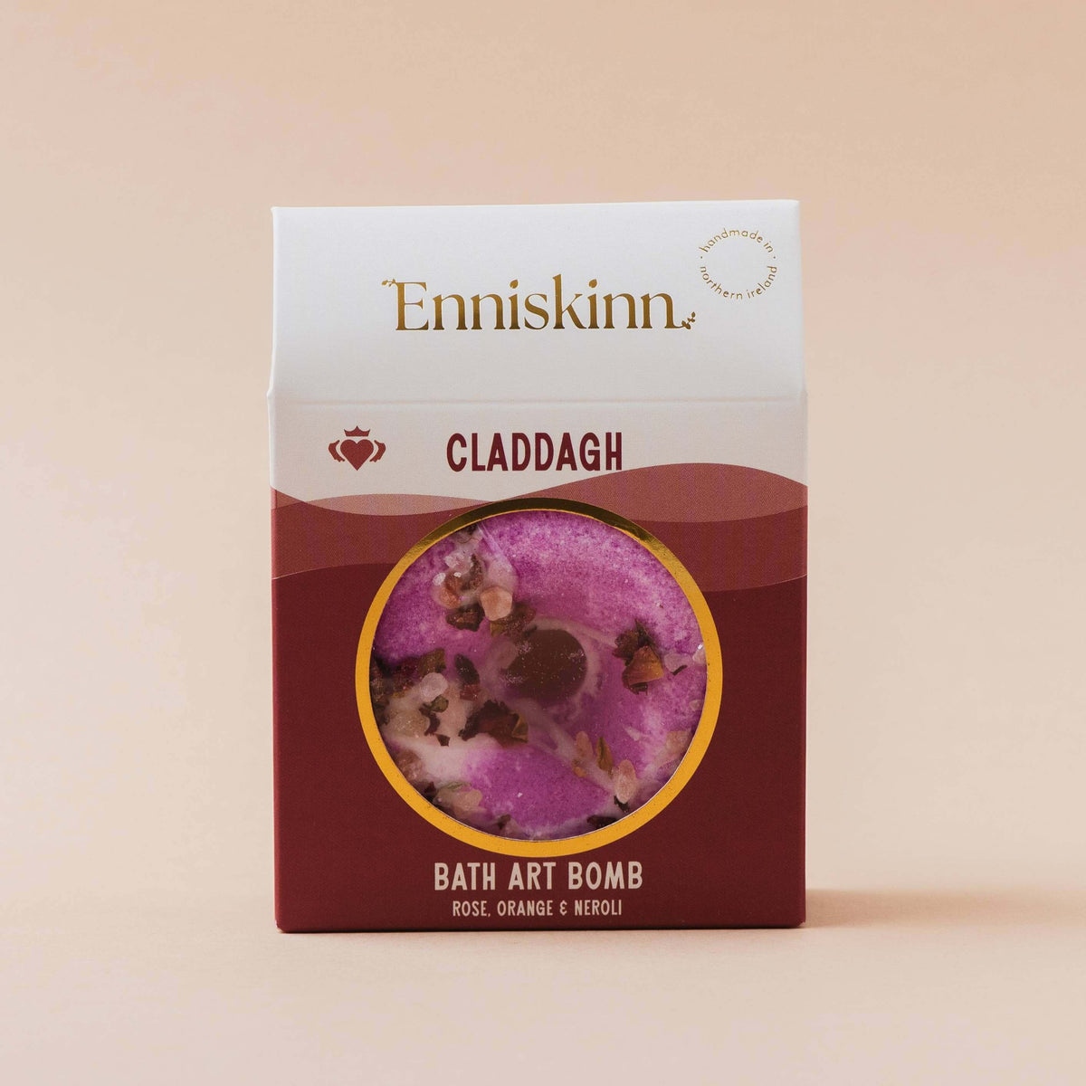Enniskinn Claddagh bath art bomb packaging on a beige background