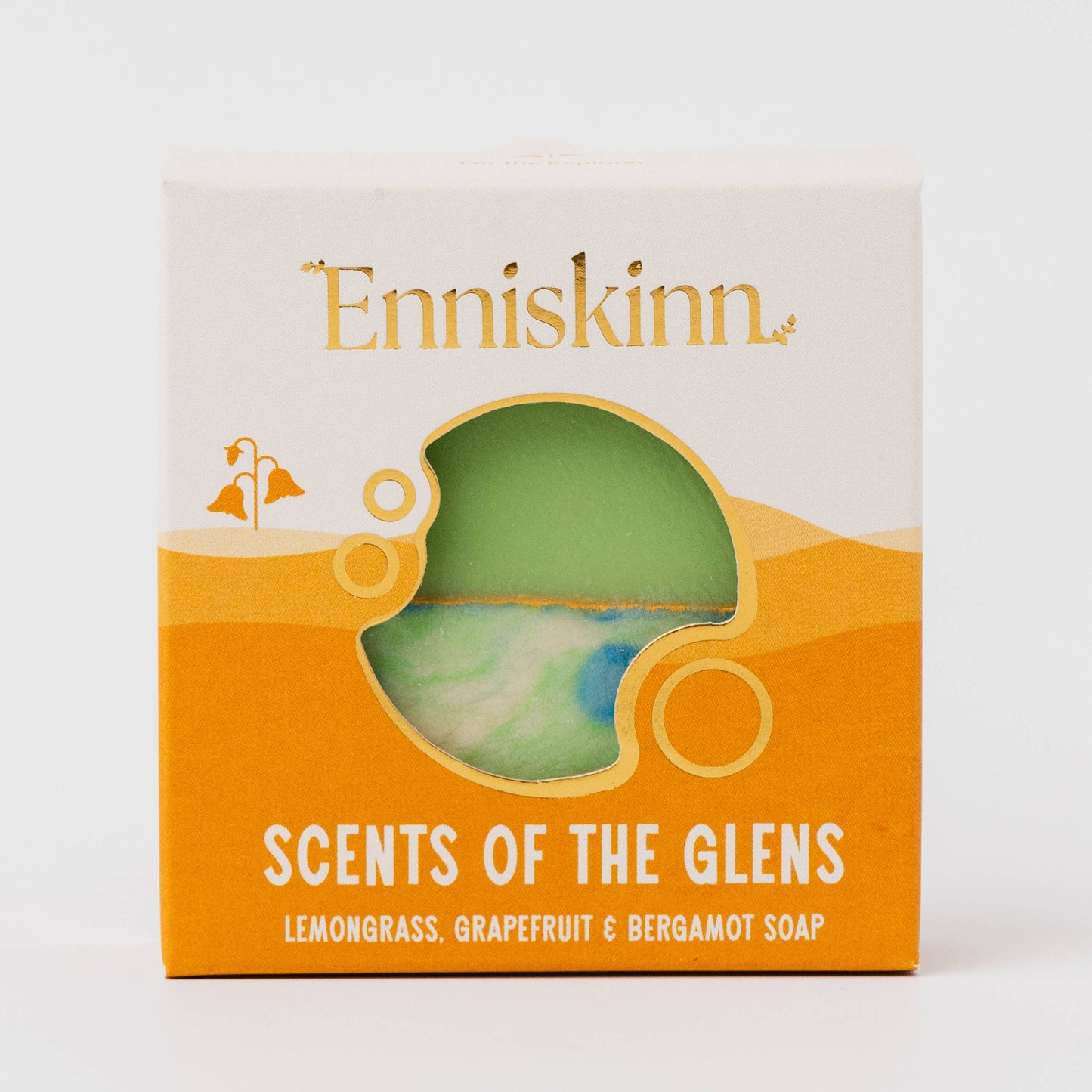 Enniskinn soap packaging with a green soap bar inside, on a white background