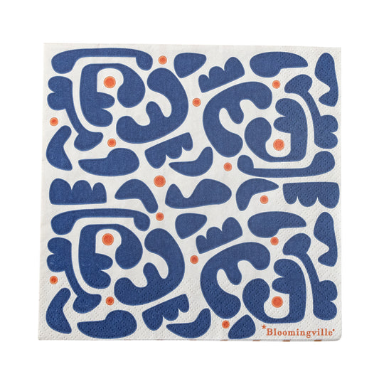 A paper napkin with a blue and red dotted pattern on a white background, with the brand name 'Bloomingville' visible.