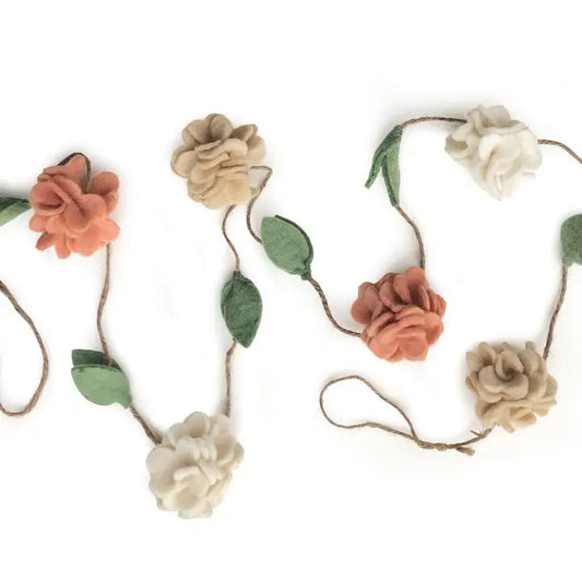 Floral garland with flowers in brown, beige, and white on a white background