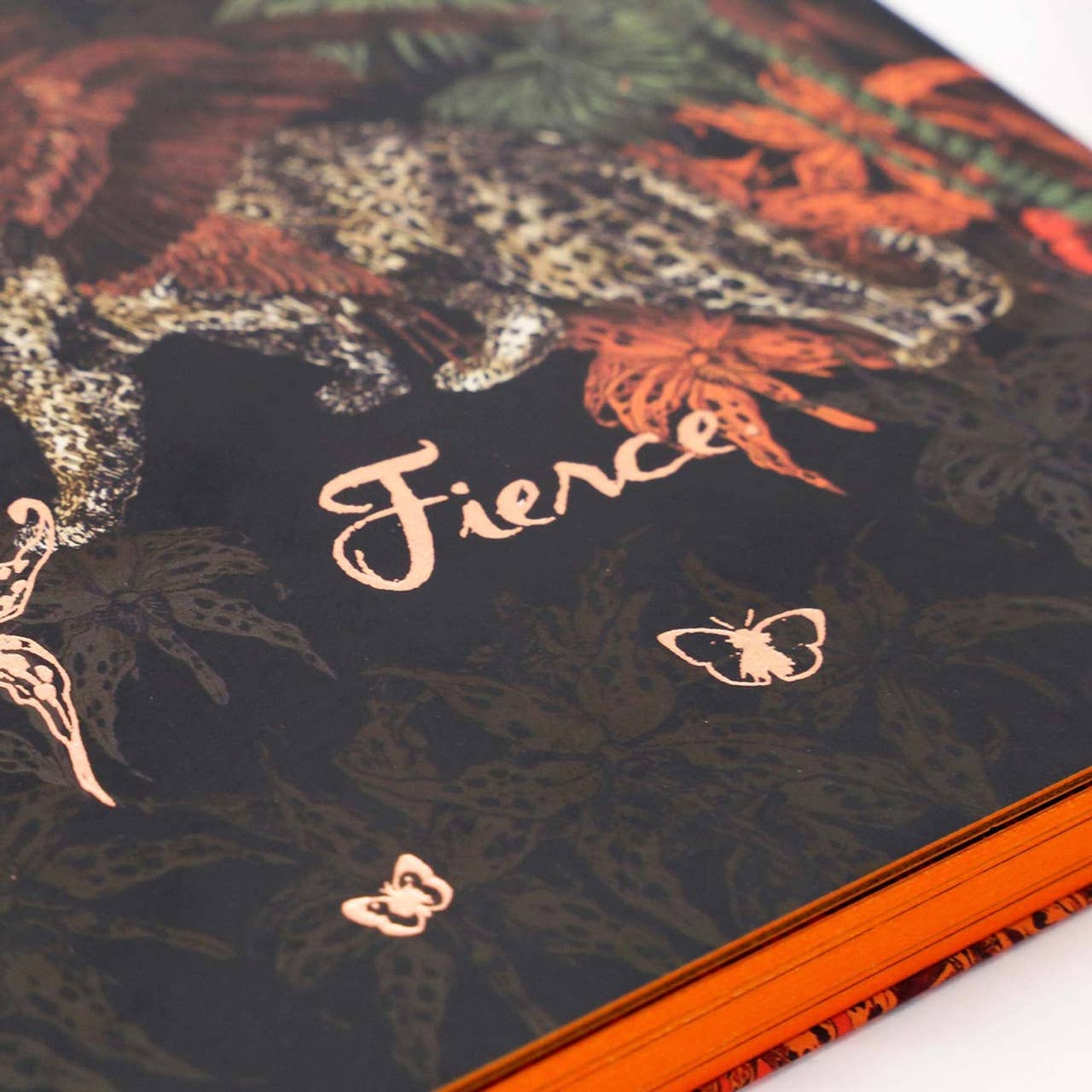 Book with floral design and 'Fierce' text on a black background