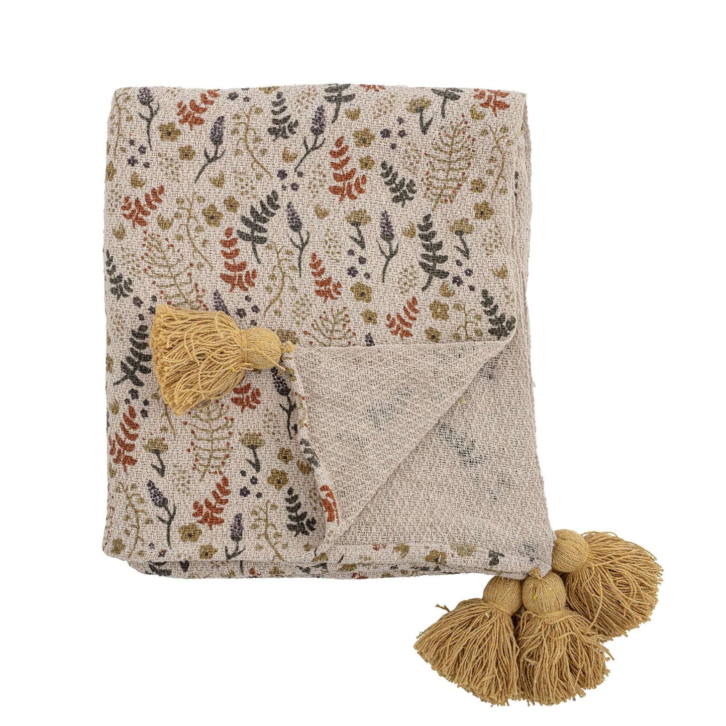 Floral patterned throw blanket with tassels on a white background