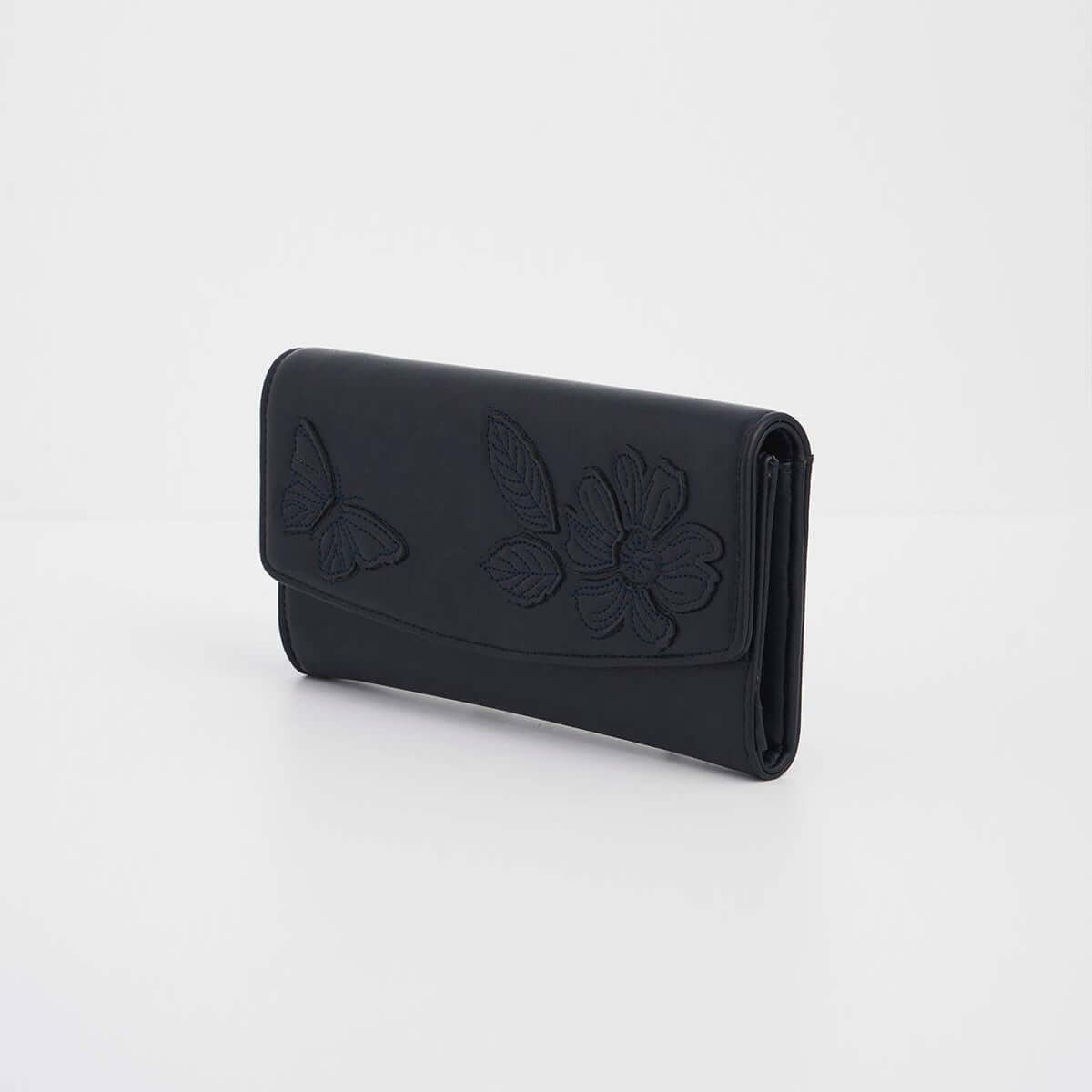 Black wallet with floral designs on a light gray background
