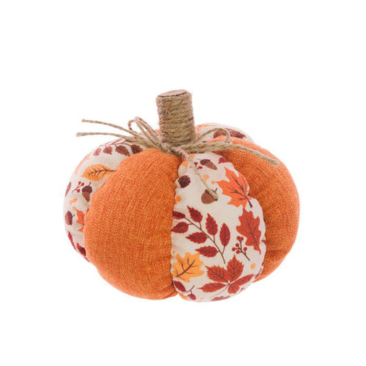 Decorative pumpkin with floral and leaf patterns on a white background