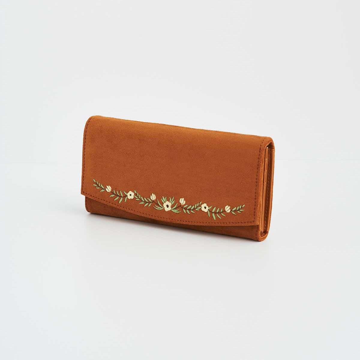 Brown wallet with floral embroidery on a light gray background