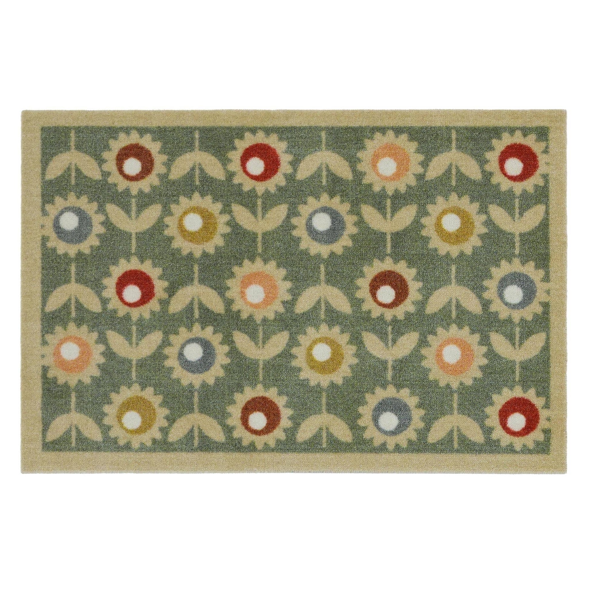 Floral patterned rug with colorful flowers on a green background