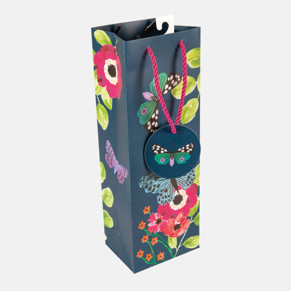 Gift bag with floral and butterfly design on a white background