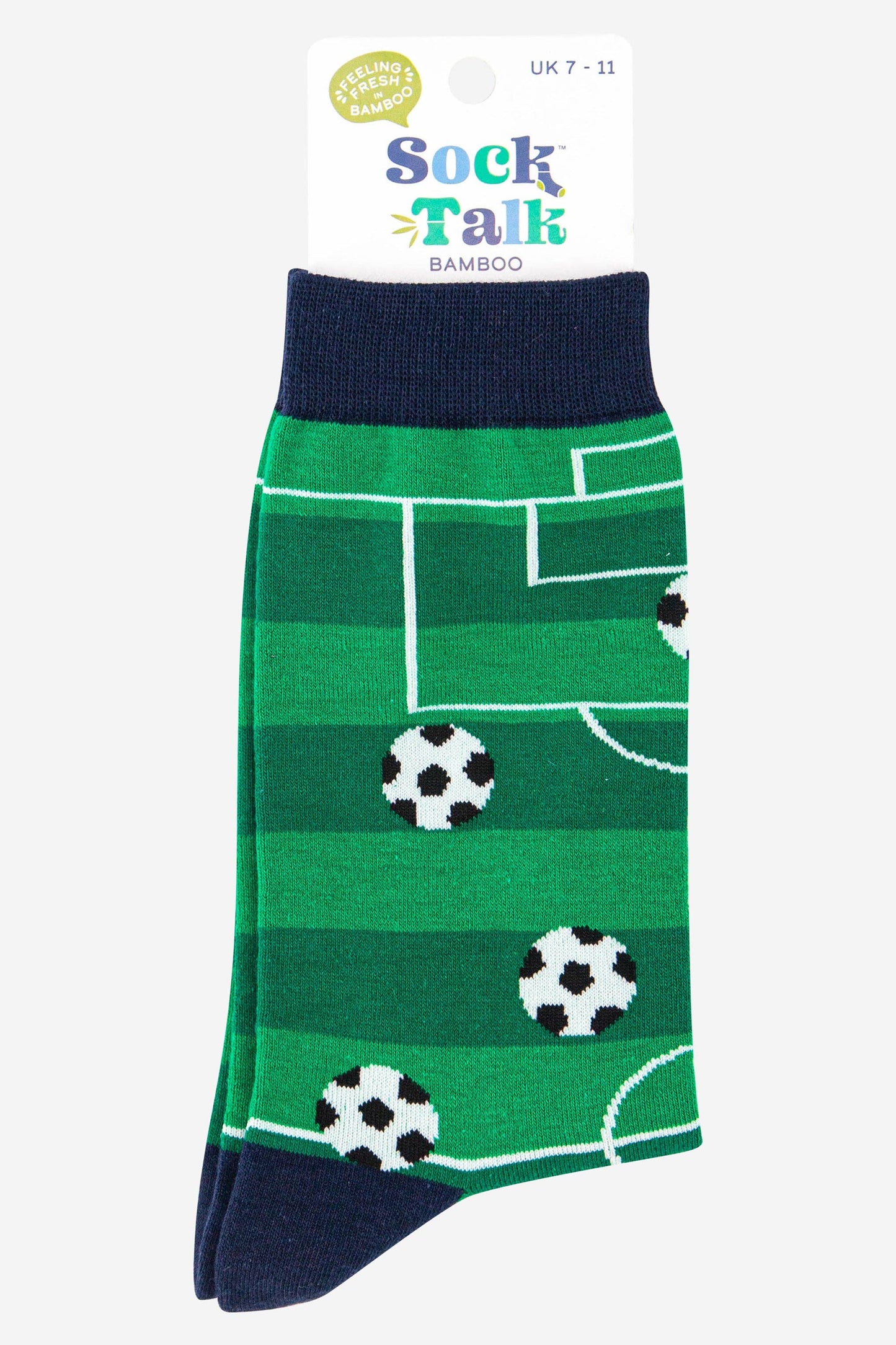 Green socks with soccer ball pattern on a white background