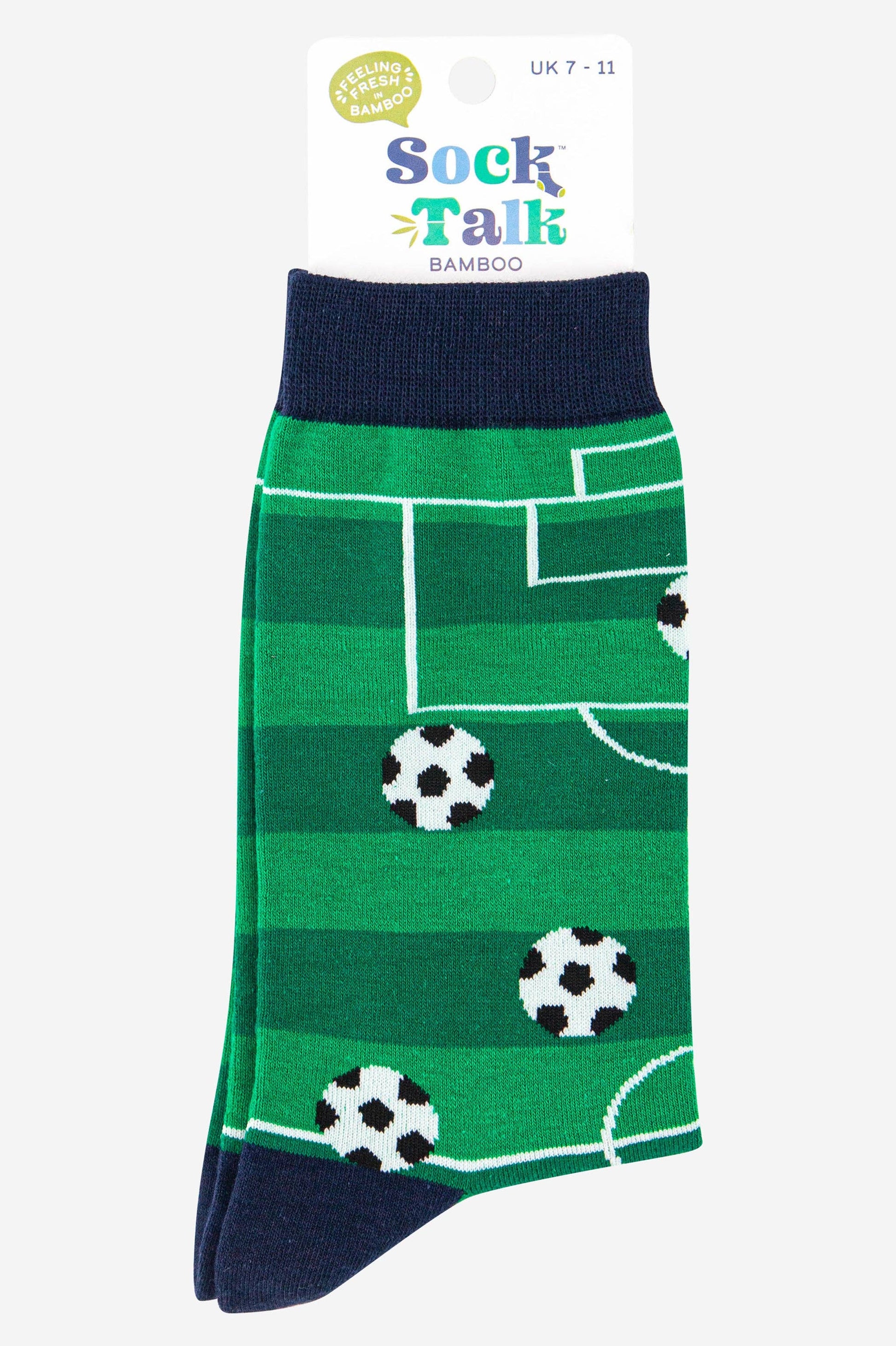 Green socks with soccer ball pattern on a white background