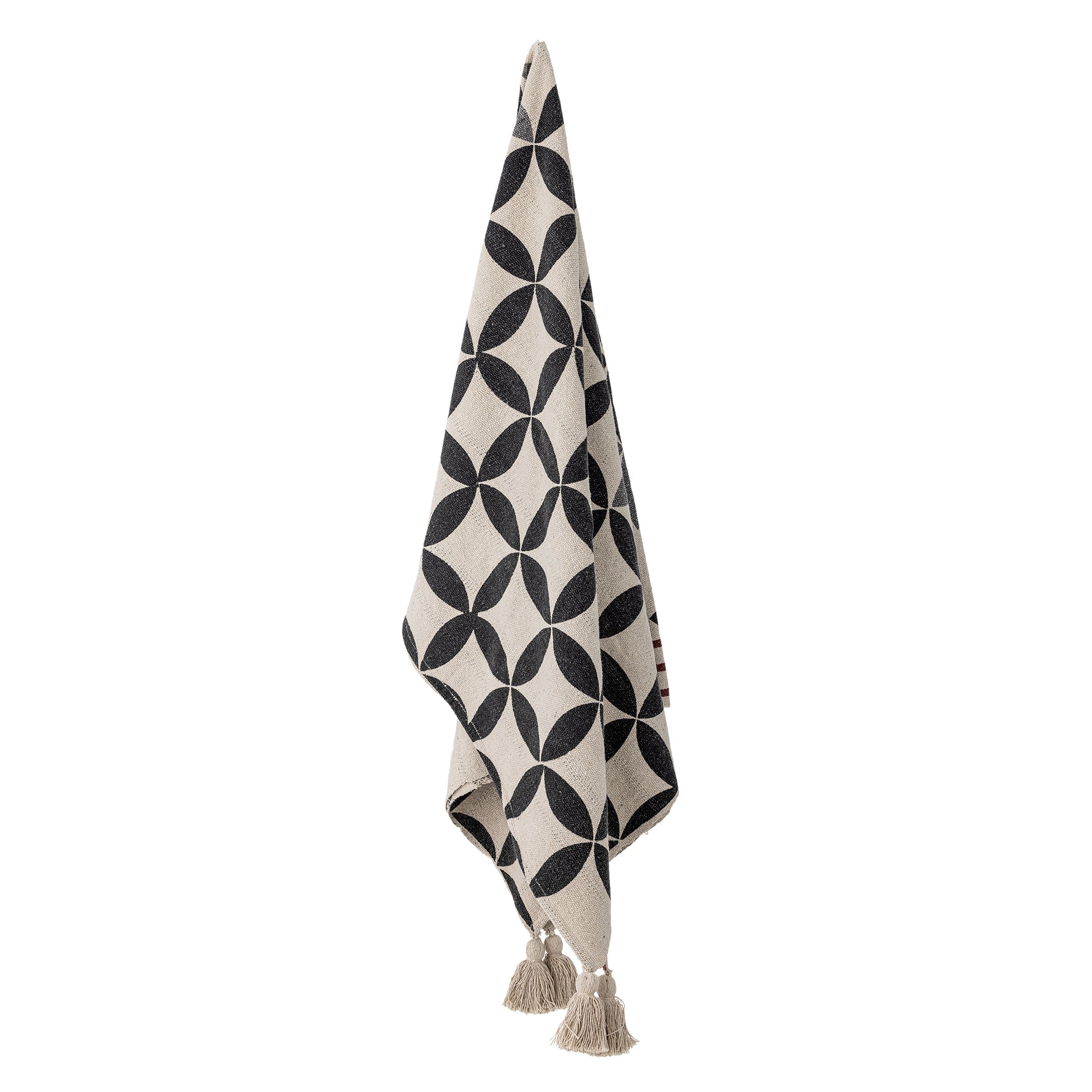 Black and white patterned towel with tassels on a white background