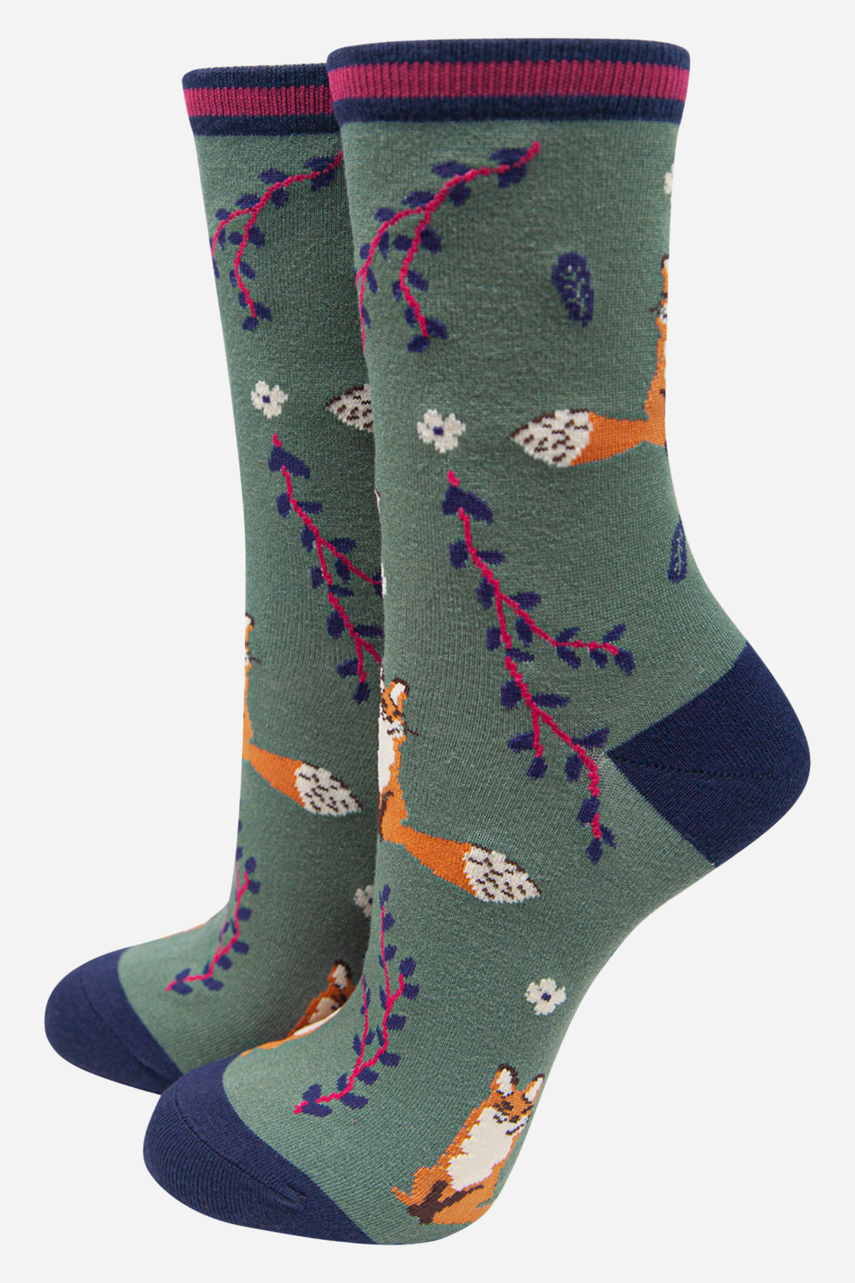 Pair of socks with floral and animal pattern on a green background