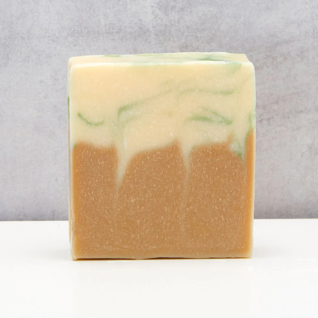 Bar of soap with a marbled design on a gray background