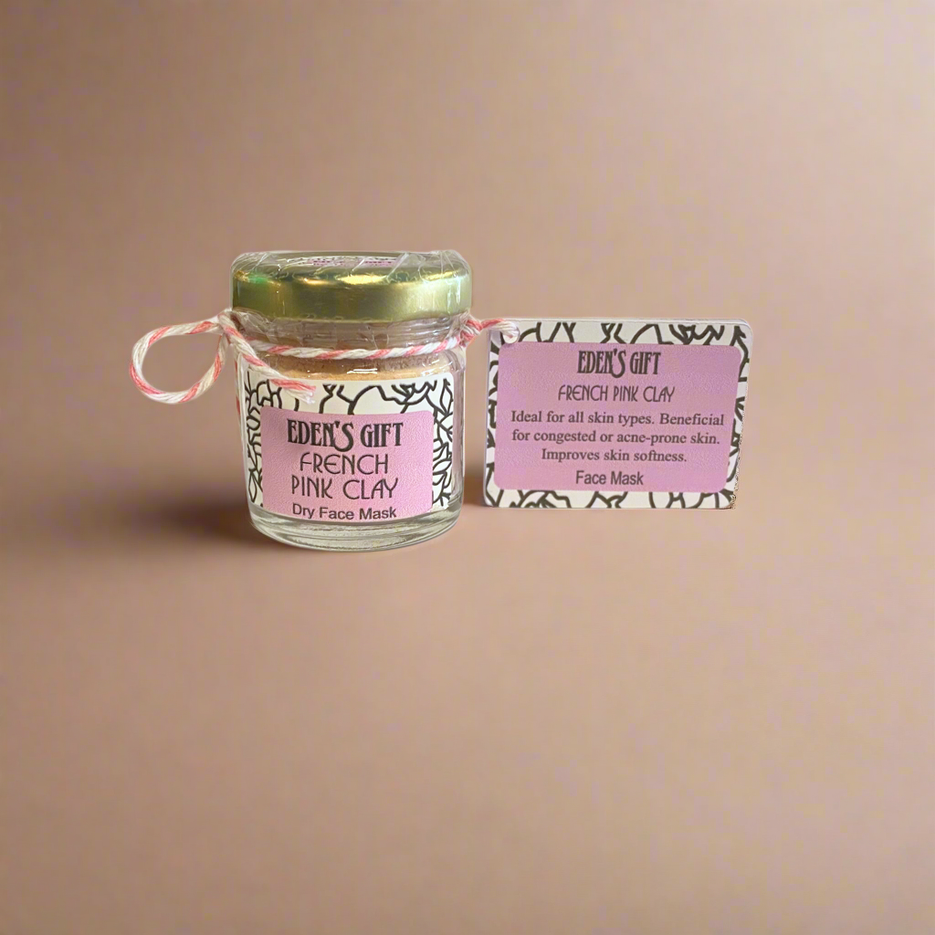 Jar of French Pink Clay face mask with a label on a beige background