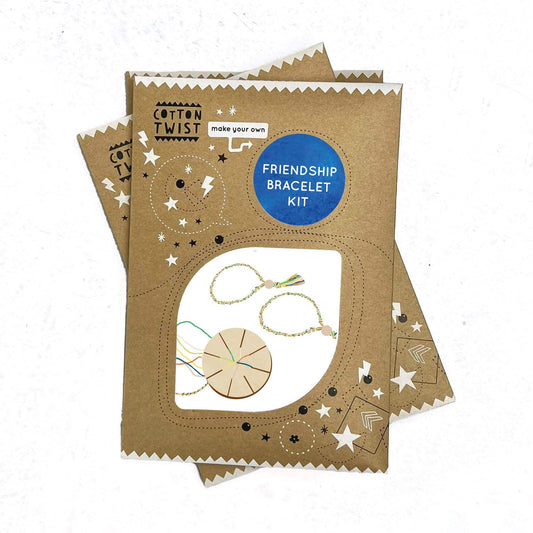 A friendship bracelet kit by Cotton Twist, including instructions and materials for making two friendship bracelets.