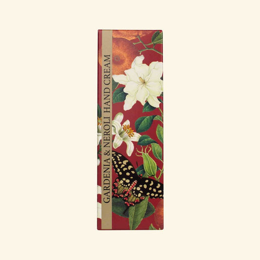 Hand cream packaging with floral design and 'Gardenia & Neroli' text on a red background