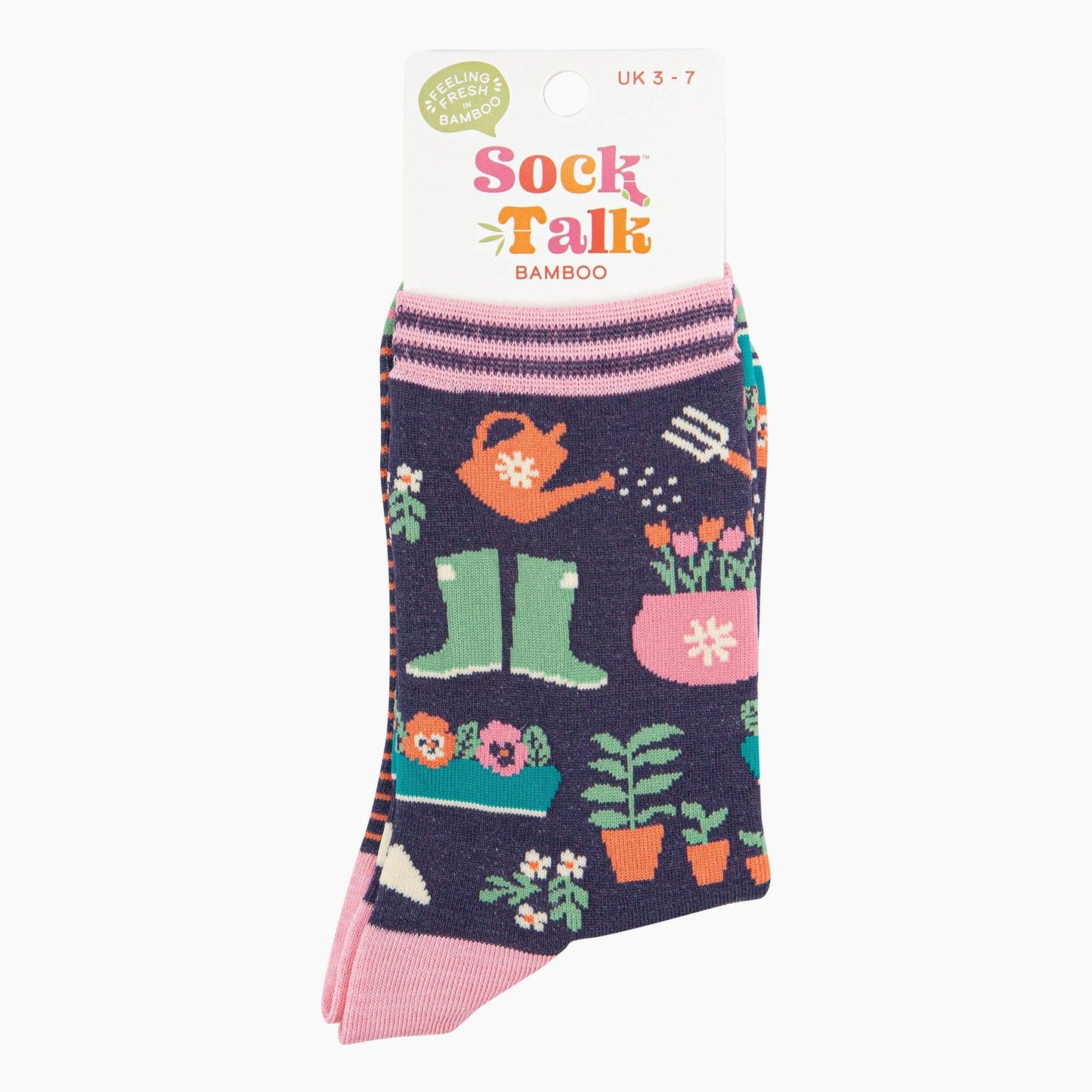 Gardening-themed socks with pink accents on a white background