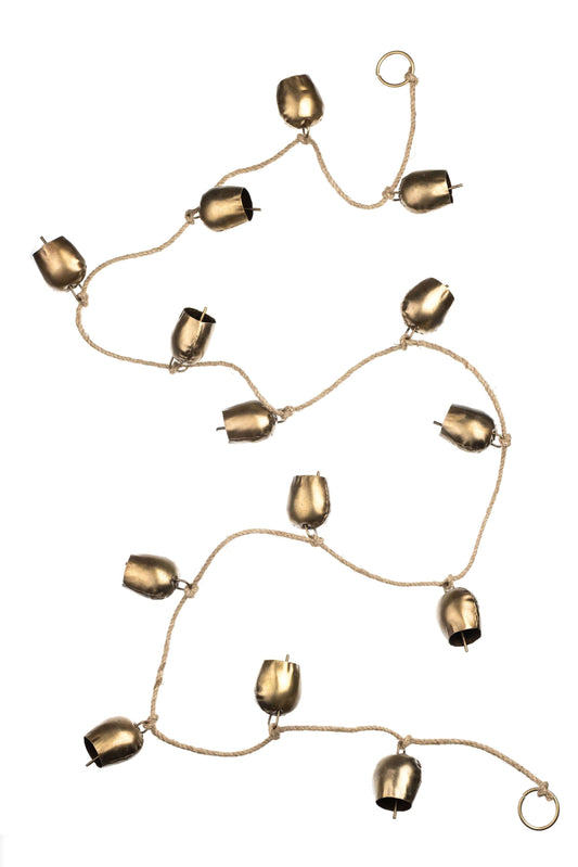 A string of small metallic cow bells on a rope, arranged in a loose spiral pattern against a solid white background.