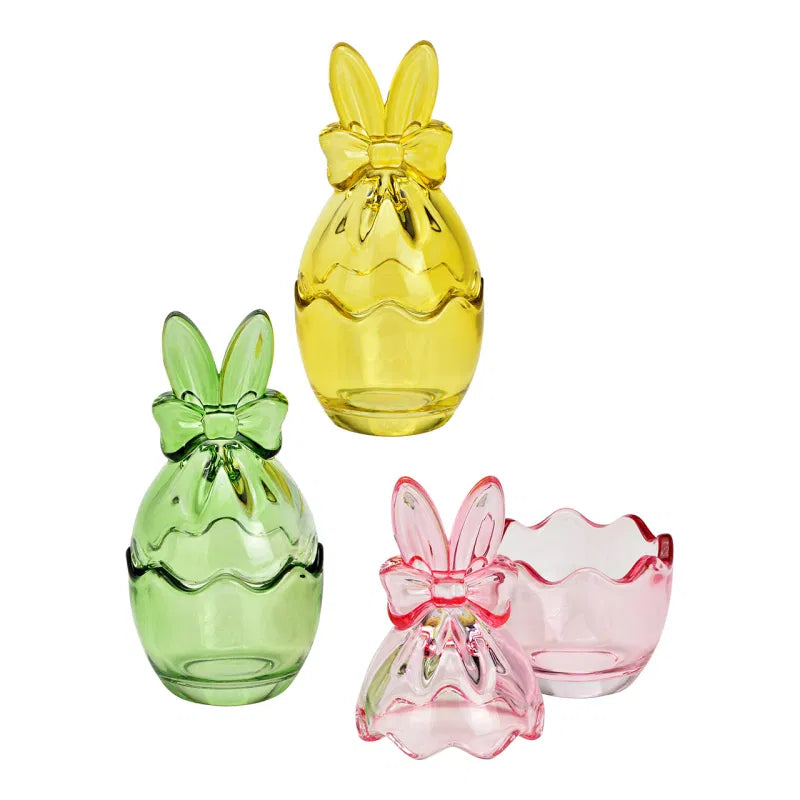 Set of colorful glass pineapple-shaped vases on a white background