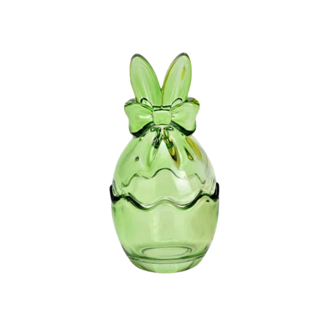 Green glass bunny egg-shaped vase with a bow on a white background