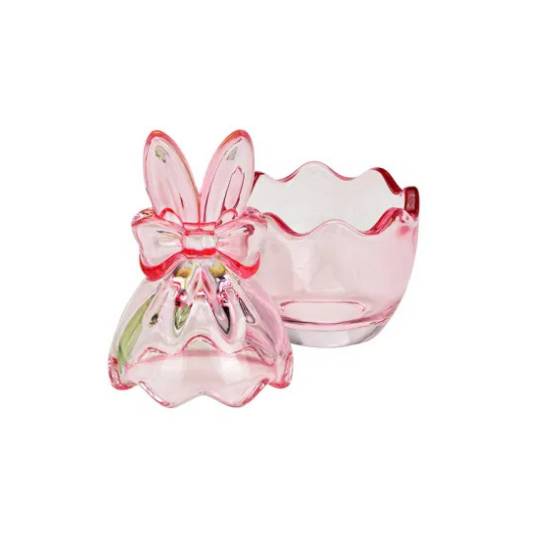 Pink glass bunny-shaped holder on a white background