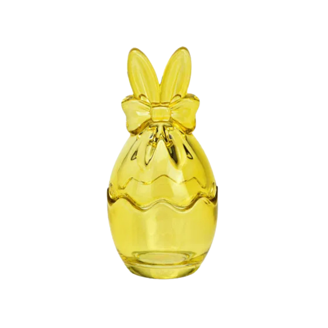 Yellow bunny eag shaped vase with a bow on a white background