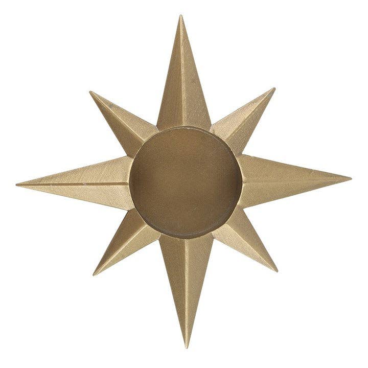 Gold star-shaped decorative tealight holder on a white background