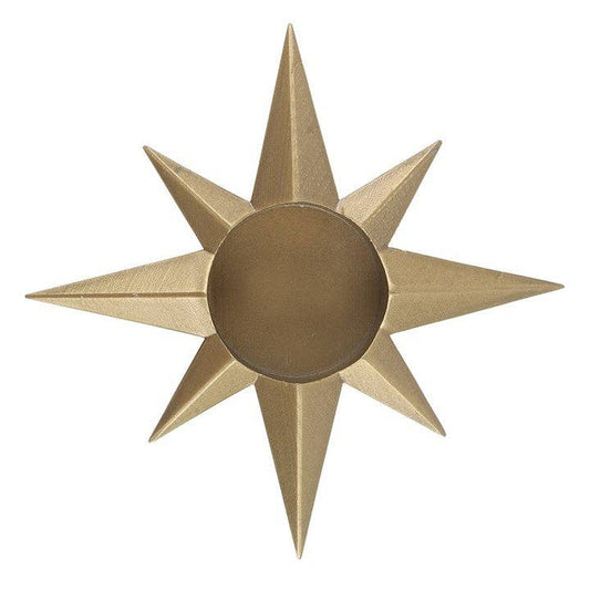 Gold star-shaped decorative tealight holder on a white background