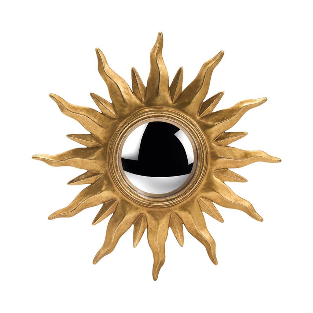 Decorative sun-shaped mirror with gold rays on a white background