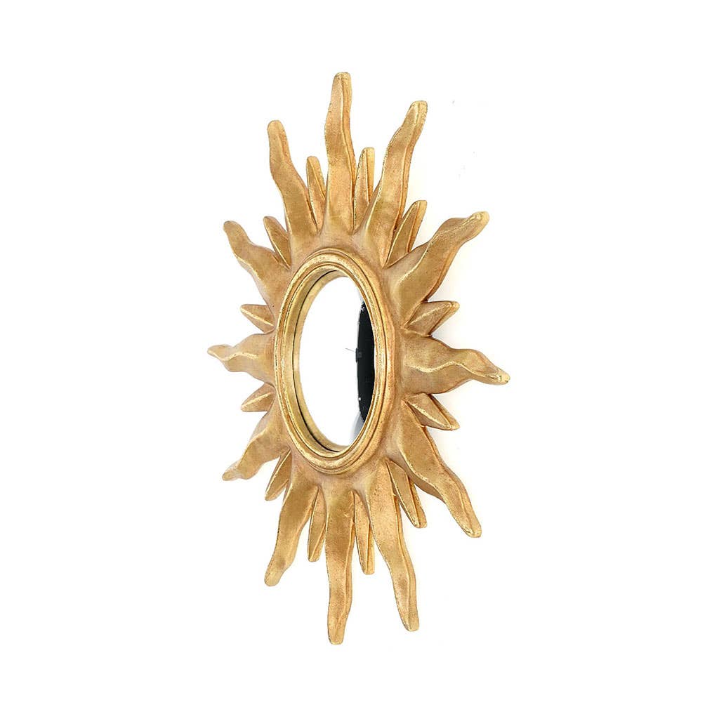 Gold sunburst mirror on a white background