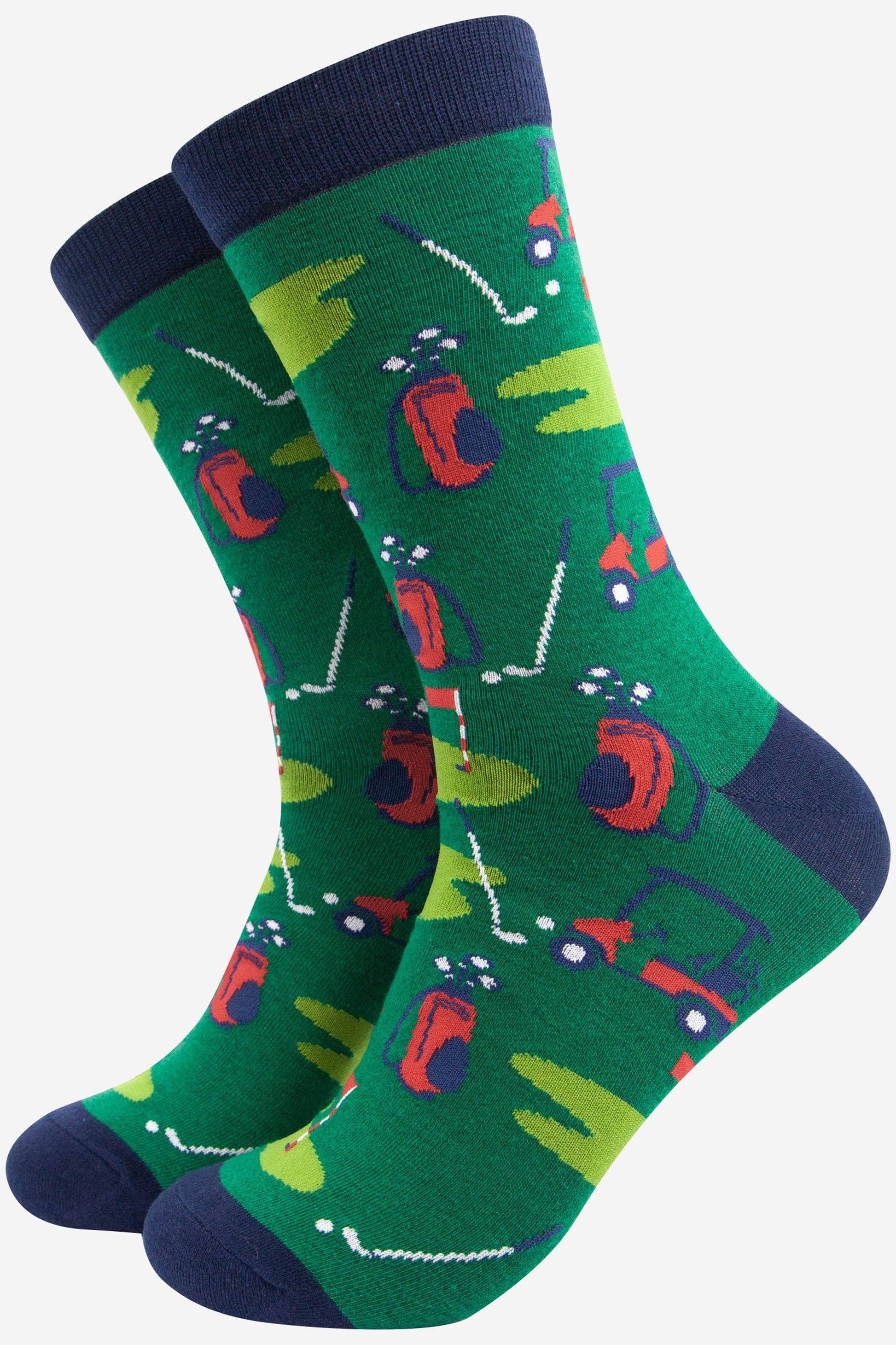 Green socks with golf-themed design on a white background