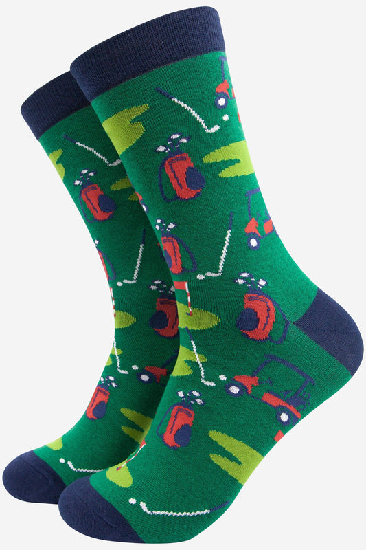 Green socks with golf-themed design on a white background