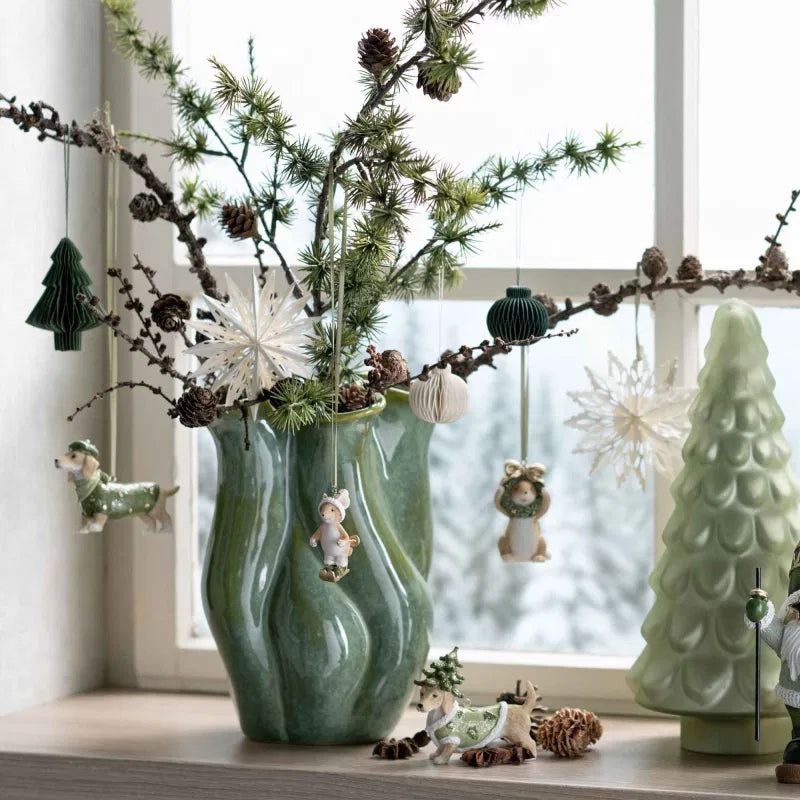 Green Fluted Top Vase on a windowsill with twigs