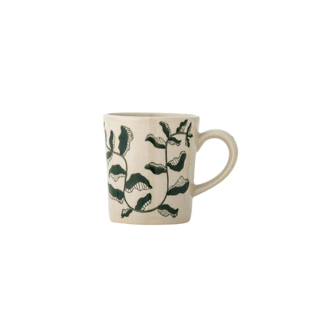 An off-white ceramic mug with a dark green botanical vine pattern, shown against a plain white background.